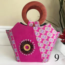 Ebele Hand Woven Raffia Fibers African Print Basket Bag with wood handle - purple / Pink - Afrilege