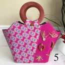 Ebele Hand Woven Raffia Fibers African Print Basket Bag with wood handle - purple / Pink - Afrilege