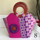 Ebele Hand Woven Raffia Fibers African Print Basket Bag with wood handle - purple / Pink - Afrilege